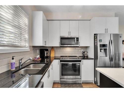 3116-298 Sage Meadows Park Nw, Calgary, AB - Indoor Photo Showing Kitchen With Stainless Steel Kitchen With Double Sink With Upgraded Kitchen