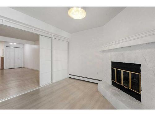 208-1528 11 Street, Calgary, AB - Indoor With Fireplace