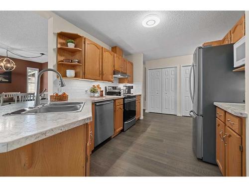 404-39 Hidden Creek Place Nw, Calgary, AB - Indoor Photo Showing Kitchen With Stainless Steel Kitchen With Double Sink