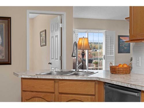 404-39 Hidden Creek Place Nw, Calgary, AB - Indoor Photo Showing Kitchen With Double Sink