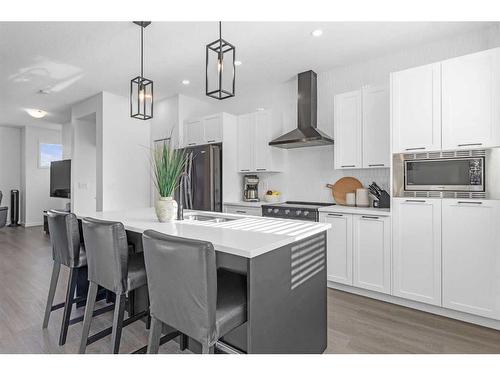 217 South Point Park Sw, Airdrie, AB - Indoor Photo Showing Kitchen With Upgraded Kitchen