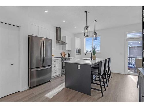 217 South Point Park Sw, Airdrie, AB - Indoor Photo Showing Kitchen With Upgraded Kitchen