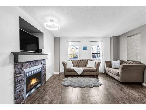 362 Copperfield Grove Se, Calgary, AB - Indoor Photo Showing Living Room With Fireplace