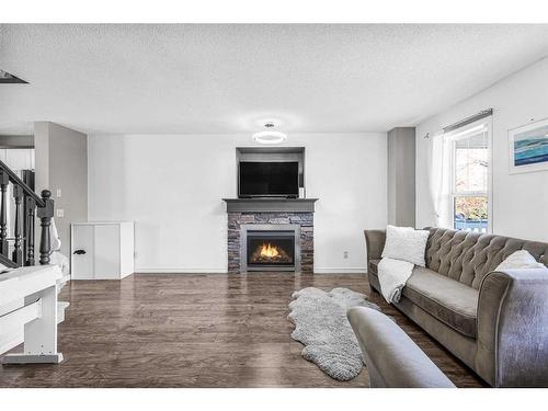 362 Copperfield Grove Se, Calgary, AB - Indoor Photo Showing Living Room With Fireplace