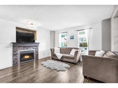 362 Copperfield Grove Se, Calgary, AB - Indoor Photo Showing Living Room With Fireplace