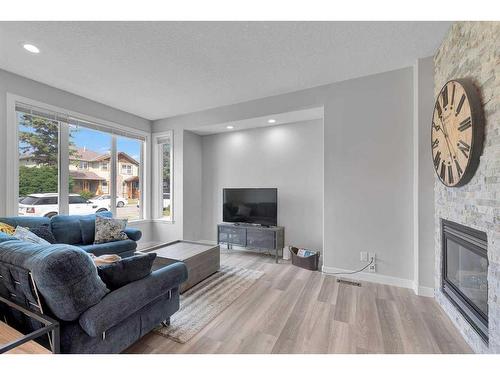 3118 38 Street Sw, Calgary, AB - Indoor Photo Showing Living Room With Fireplace