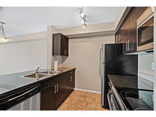 1311-81 Legacy Boulevard Se, Calgary, AB - Indoor Photo Showing Kitchen With Stainless Steel Kitchen With Double Sink