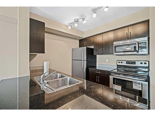 1311-81 Legacy Boulevard Se, Calgary, AB - Indoor Photo Showing Kitchen With Stainless Steel Kitchen With Double Sink