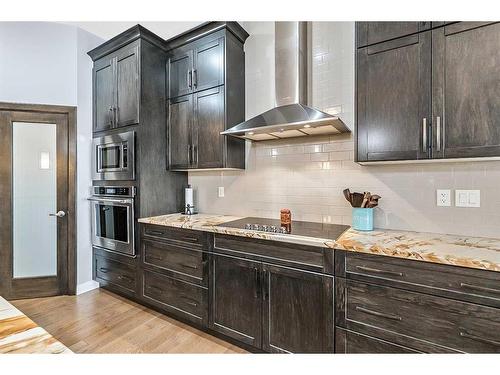 156 Ranch Road, Okotoks, AB - Indoor Photo Showing Kitchen With Upgraded Kitchen