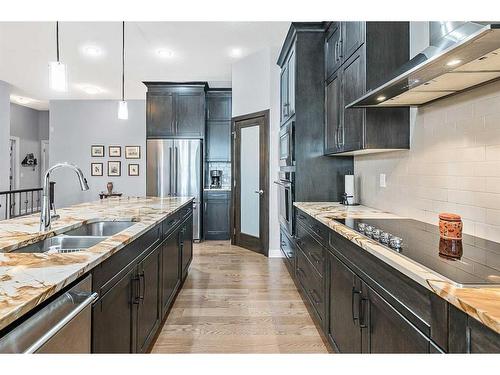 156 Ranch Road, Okotoks, AB - Indoor Photo Showing Kitchen With Double Sink With Upgraded Kitchen