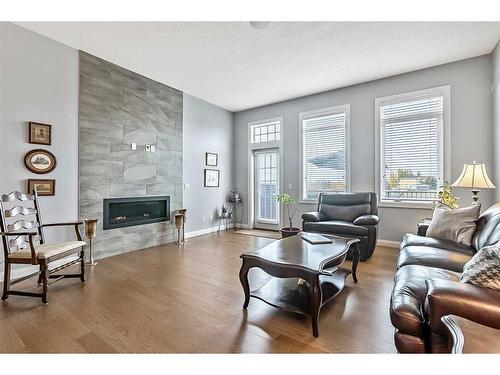 156 Ranch Road, Okotoks, AB - Indoor Photo Showing Living Room With Fireplace