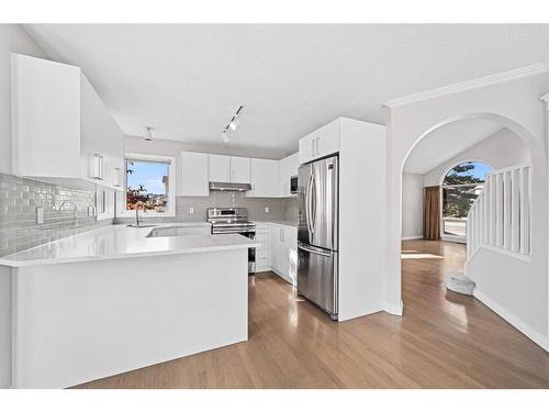 9051 Scurfield Drive Nw, Calgary, AB - Indoor Photo Showing Kitchen With Double Sink