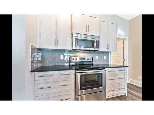 1422-2461 Bayspring Link Sw, Airdrie, AB - Indoor Photo Showing Kitchen With Upgraded Kitchen