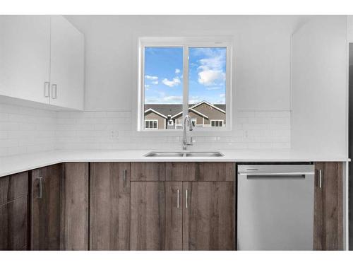 415-137 Red Embers Link Ne, Calgary, AB - Indoor Photo Showing Kitchen With Double Sink With Upgraded Kitchen