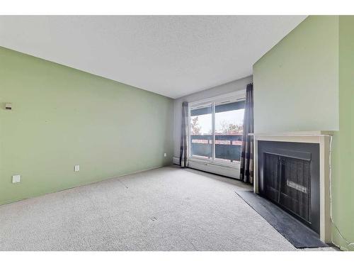 5312-315 Southampton Drive Sw, Calgary, AB - Indoor With Fireplace