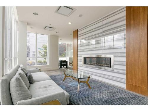 1102-128 2 Street Sw, Calgary, AB - Indoor Photo Showing Living Room With Fireplace