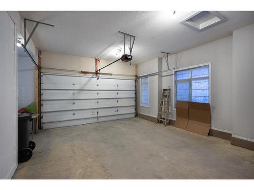 109 Kinniburgh Boulevard, Chestermere, AB - Indoor Photo Showing Garage