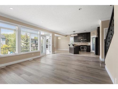 109 Kinniburgh Boulevard, Chestermere, AB - Indoor Photo Showing Living Room