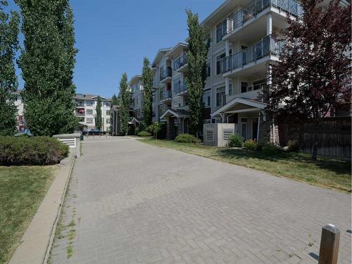 314-22 Auburn Bay Link Se, Calgary, AB - Outdoor With Balcony With Facade