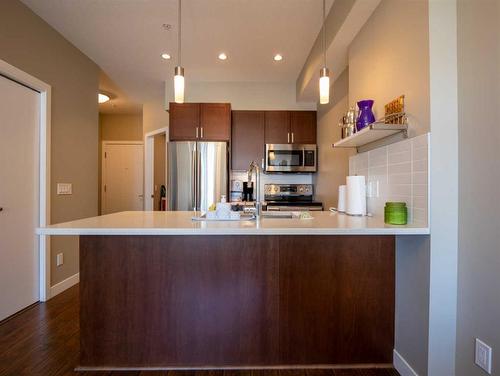 314-22 Auburn Bay Link Se, Calgary, AB - Indoor Photo Showing Kitchen With Stainless Steel Kitchen With Upgraded Kitchen