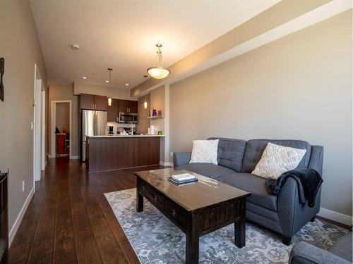 314-22 Auburn Bay Link Se, Calgary, AB - Indoor Photo Showing Living Room