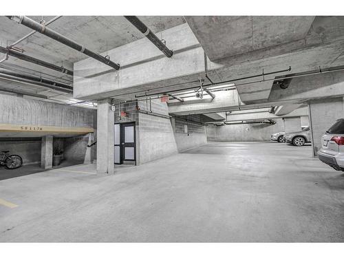 304-205 Riverfront Avenue Sw, Calgary, AB - Indoor Photo Showing Garage