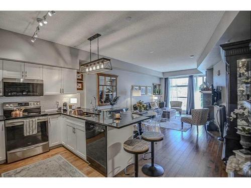 304-205 Riverfront Avenue Sw, Calgary, AB - Indoor Photo Showing Kitchen With Stainless Steel Kitchen