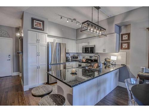 304-205 Riverfront Avenue Sw, Calgary, AB - Indoor Photo Showing Kitchen With Stainless Steel Kitchen With Upgraded Kitchen