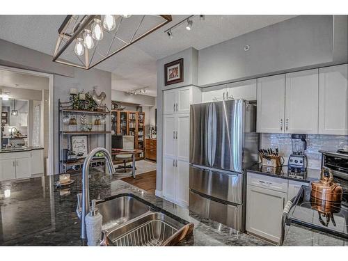 304-205 Riverfront Avenue Sw, Calgary, AB - Indoor Photo Showing Kitchen With Stainless Steel Kitchen With Double Sink With Upgraded Kitchen