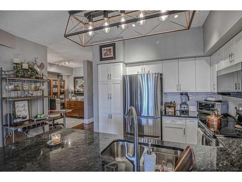 304-205 Riverfront Avenue Sw, Calgary, AB - Indoor Photo Showing Kitchen With Stainless Steel Kitchen With Double Sink With Upgraded Kitchen