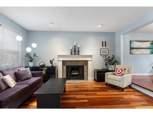 79 Woodfield Crescent Sw, Calgary, AB - Indoor Photo Showing Living Room With Fireplace