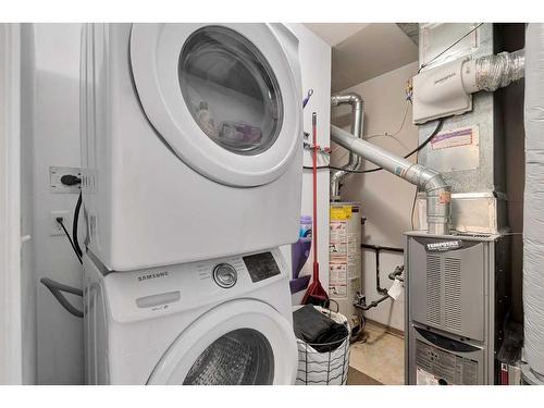 15 Cedar Springs Gardens Sw, Calgary, AB - Indoor Photo Showing Laundry Room