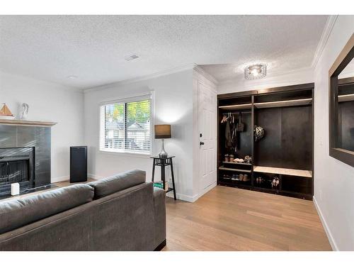 15 Cedar Springs Gardens Sw, Calgary, AB - Indoor Photo Showing Living Room With Fireplace