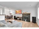 15 Cedar Springs Gardens Sw, Calgary, AB  - Indoor Photo Showing Living Room With Fireplace 