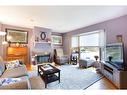 73 Langton Drive Sw, Calgary, AB  - Indoor Photo Showing Living Room With Fireplace 