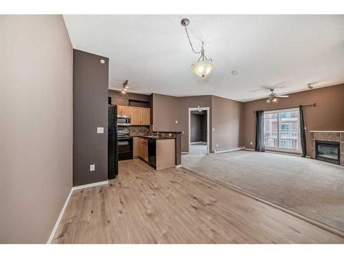 5311-70 Panamount Drive Nw, Calgary, AB - Indoor Photo Showing Other Room With Fireplace