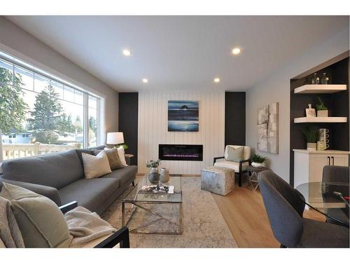 655 84 Avenue Sw, Calgary, AB - Indoor Photo Showing Living Room With Fireplace