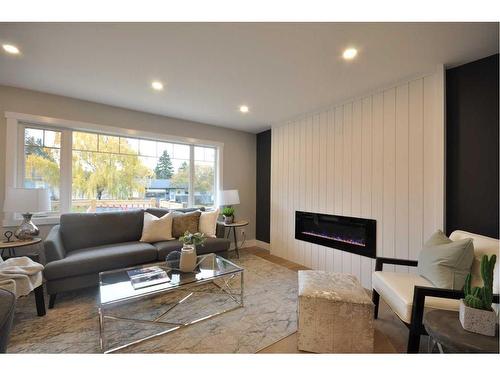 655 84 Avenue Sw, Calgary, AB - Indoor Photo Showing Living Room With Fireplace