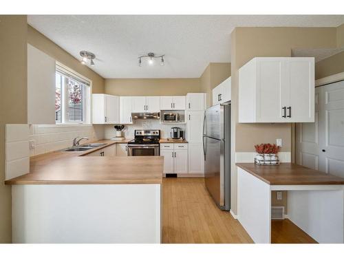 72 Inverness Square Se, Calgary, AB - Indoor Photo Showing Kitchen With Double Sink