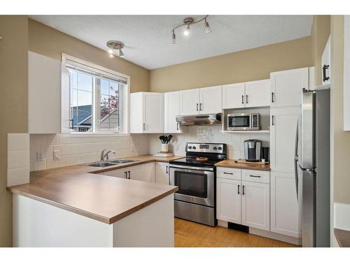 72 Inverness Square Se, Calgary, AB - Indoor Photo Showing Kitchen With Double Sink