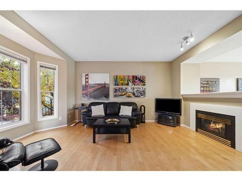 72 Inverness Square Se, Calgary, AB - Indoor Photo Showing Living Room With Fireplace