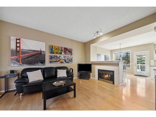 72 Inverness Square Se, Calgary, AB - Indoor Photo Showing Living Room With Fireplace