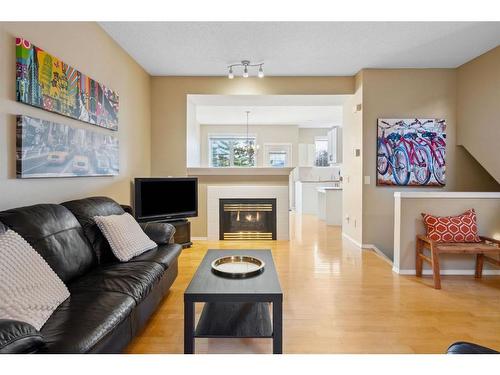 72 Inverness Square Se, Calgary, AB - Indoor Photo Showing Living Room With Fireplace