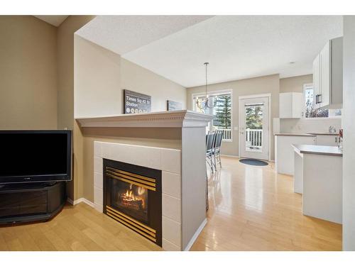 72 Inverness Square Se, Calgary, AB - Indoor Photo Showing Living Room With Fireplace