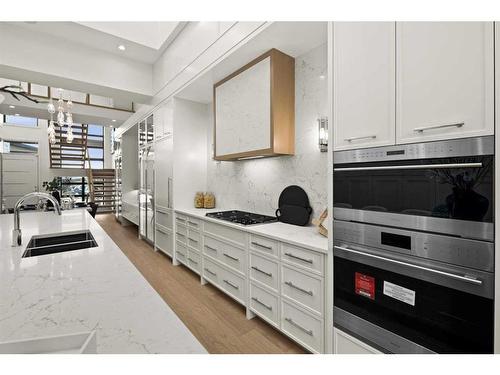 312 Elveden Court Sw, Calgary, AB - Indoor Photo Showing Kitchen With Double Sink With Upgraded Kitchen