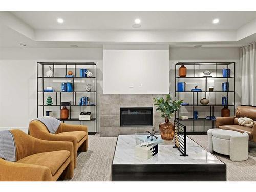 312 Elveden Court Sw, Calgary, AB - Indoor Photo Showing Living Room With Fireplace