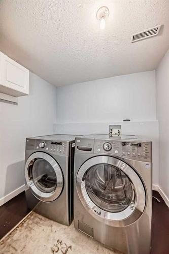 412 Willowbrook Close Nw, Airdrie, AB - Indoor Photo Showing Laundry Room