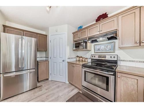 412 Willowbrook Close Nw, Airdrie, AB - Indoor Photo Showing Kitchen With Stainless Steel Kitchen