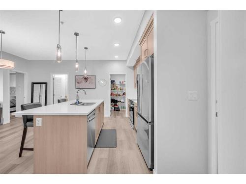 1411-220 Seton Grove Se, Calgary, AB - Indoor Photo Showing Kitchen