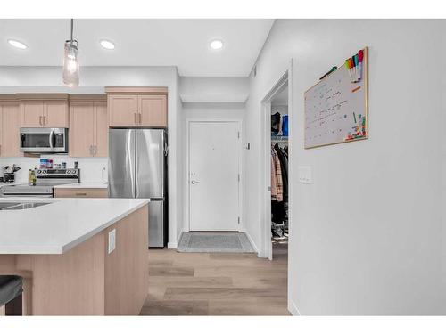 1411-220 Seton Grove Se, Calgary, AB - Indoor Photo Showing Kitchen With Stainless Steel Kitchen